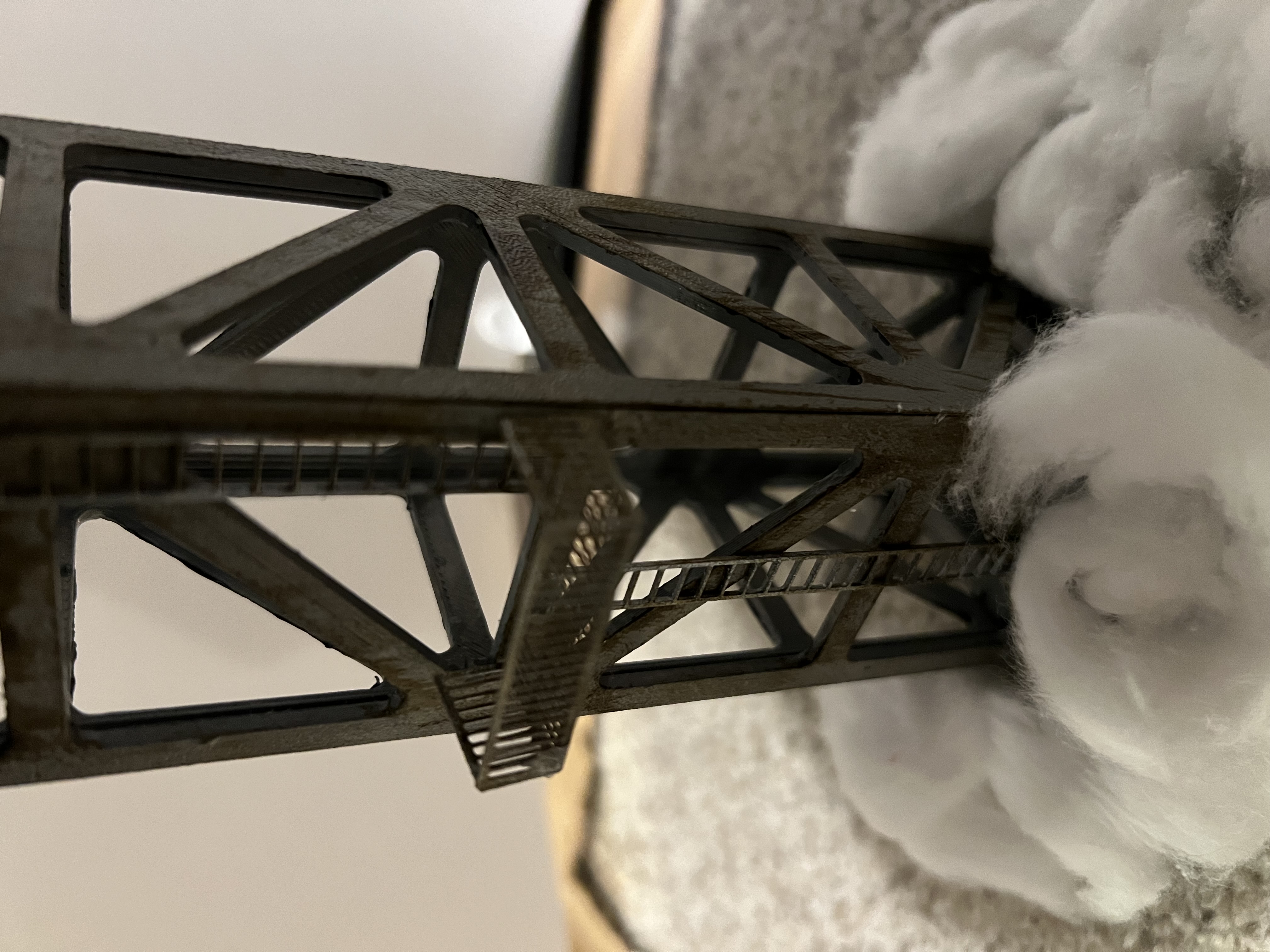 The finished truss with fire escape and ladder attached, rising out of a sea of fluffy clouds.