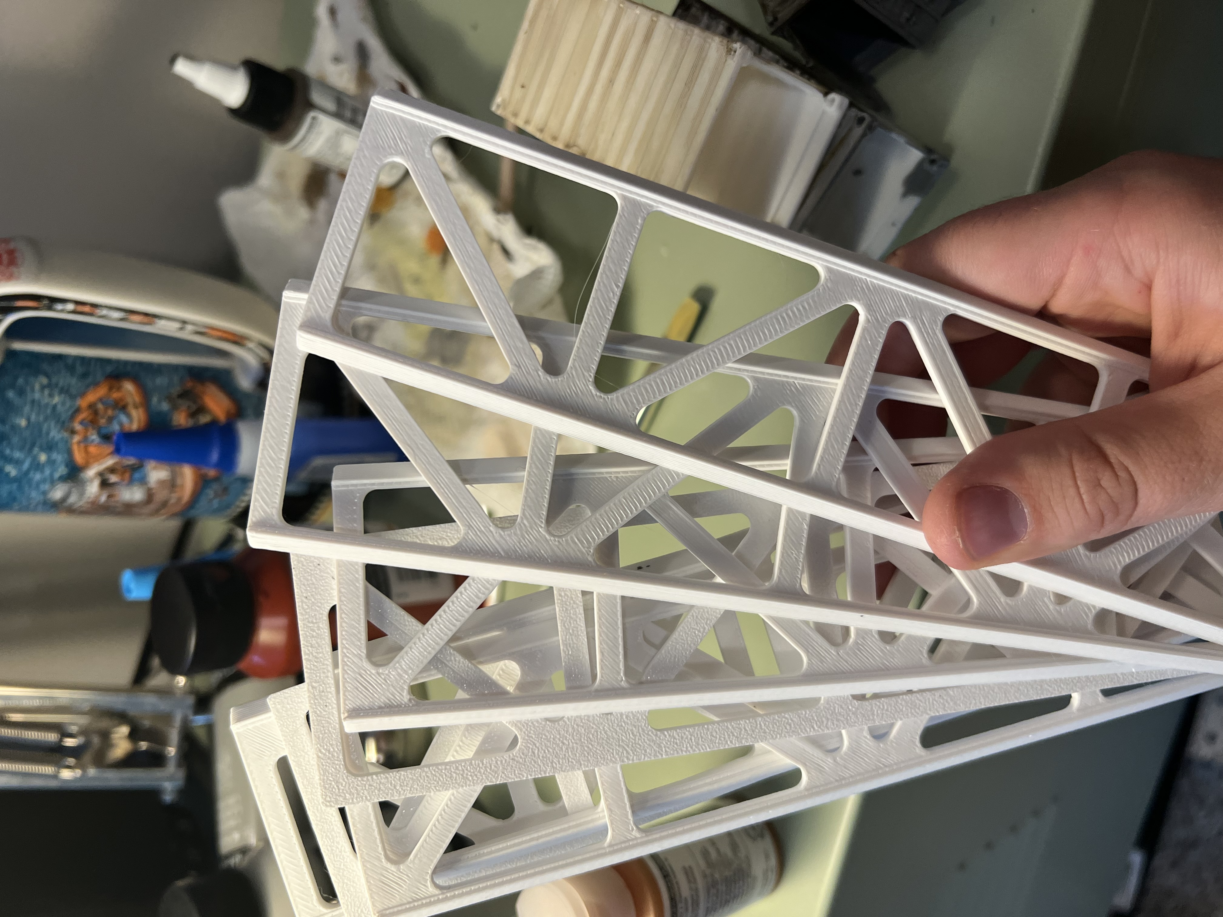 Four flat truss sides printed as separate pieces, lying on the print bed.